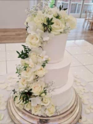 Cascading White Florals and Green Foliage - £315